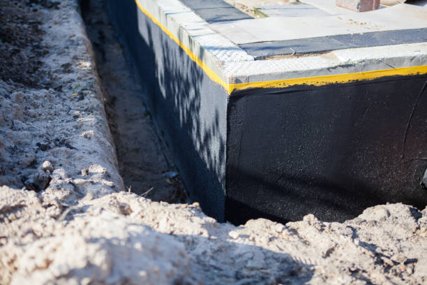 Professional Basement Waterproofing technician working in Grandville, MI